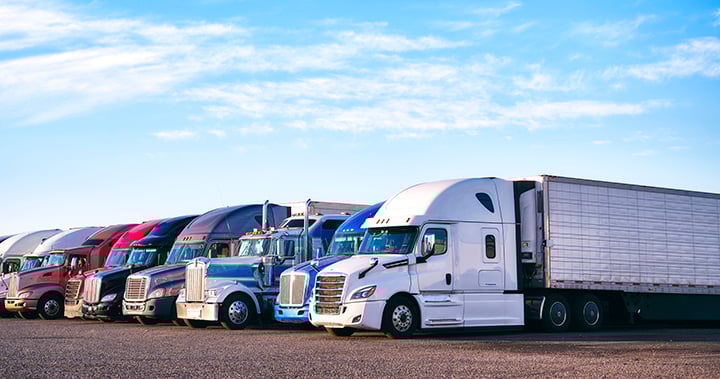 fleet of trucks parked in a parking lot